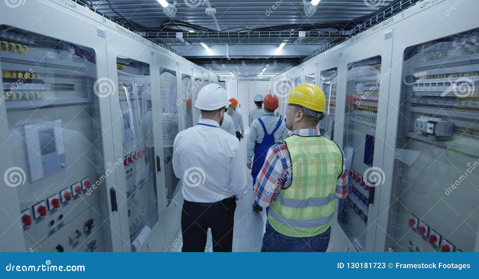Electrical Workers Walking in the Control Room Stock Image Image of