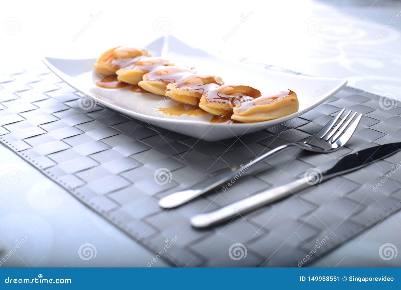 wide spread of abalone servings in a fine dining setting