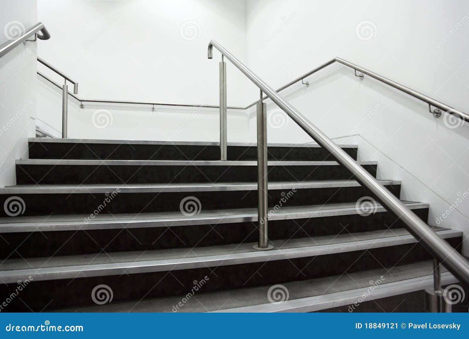 wide staircase with chrome handrails
