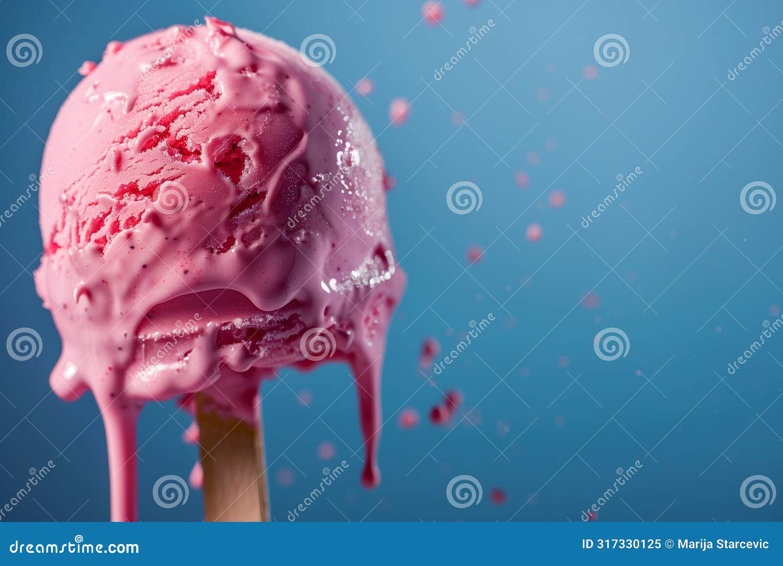 wierd home made strawbery ice cream on the stick  on a blue background