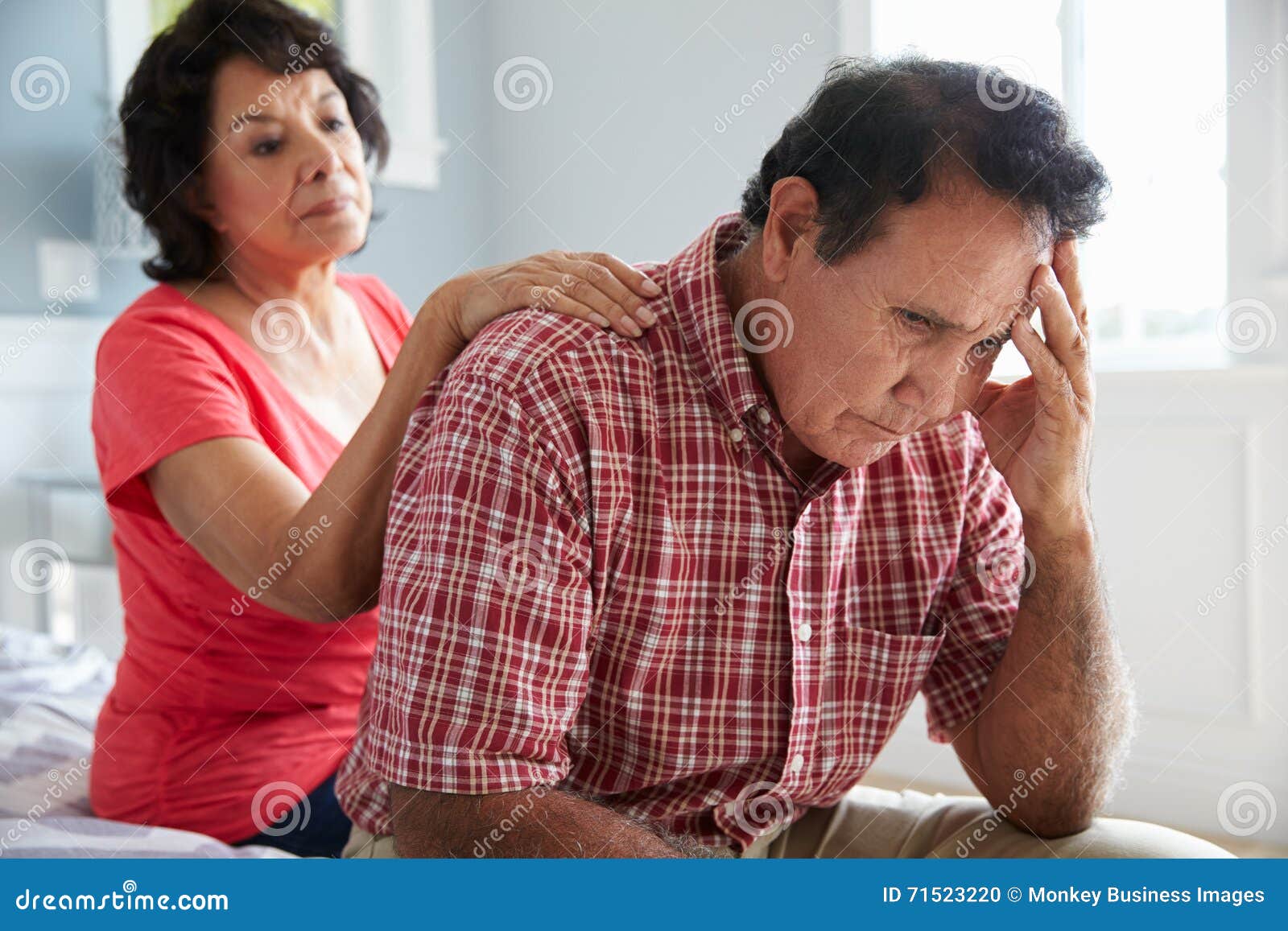 wife comforting senior husband suffering with dementia