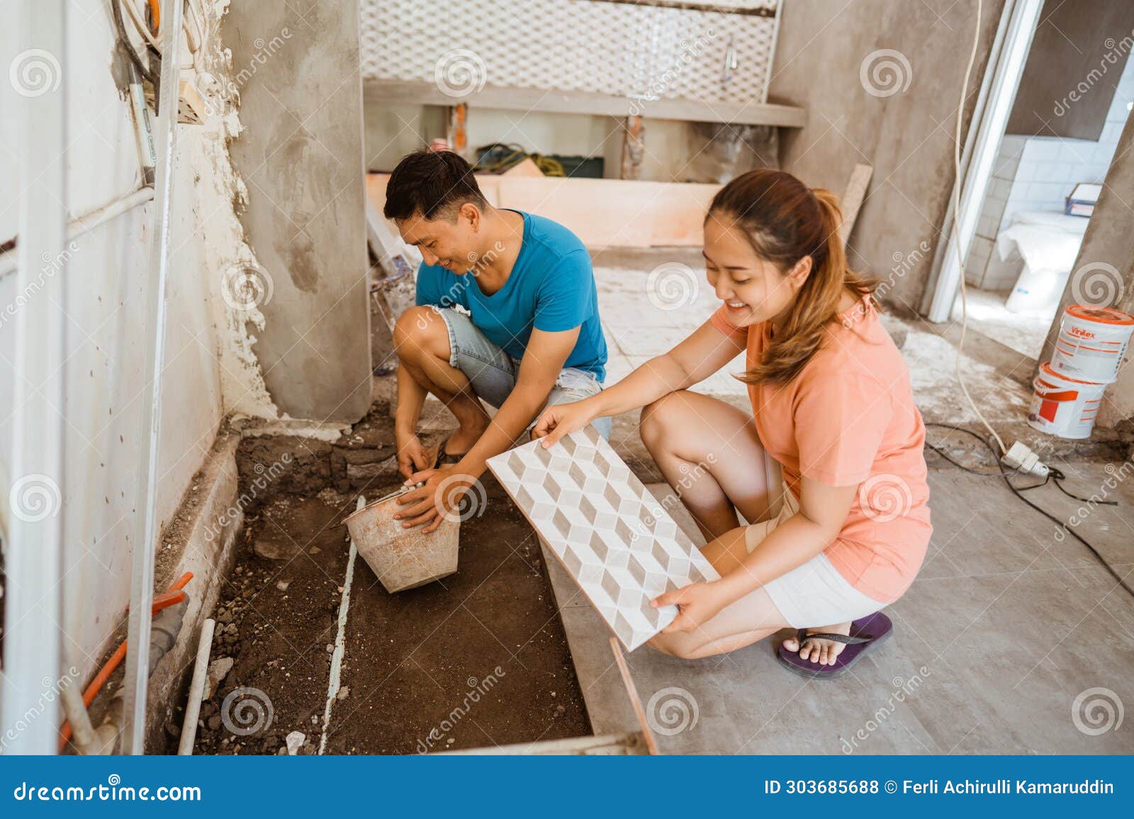 Wife Helps Husband with Tiling Work As a Builder when Building Stock