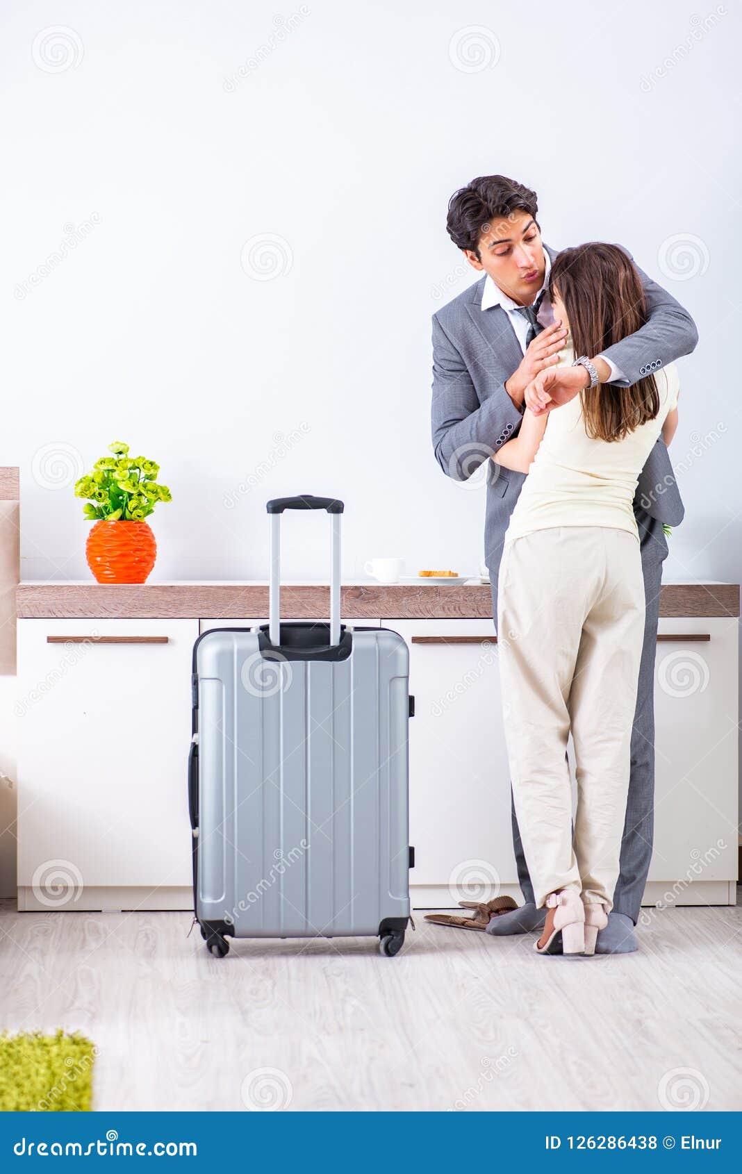 The Wife Seeing Her Husband Off To Business Trip Stoc photo