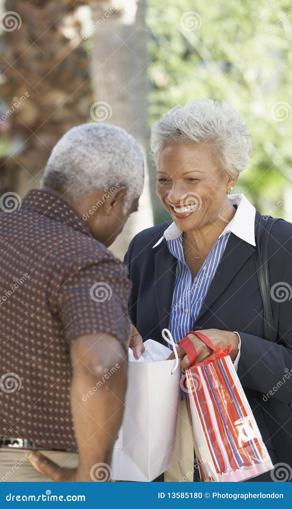 wife showing husband contents of bag