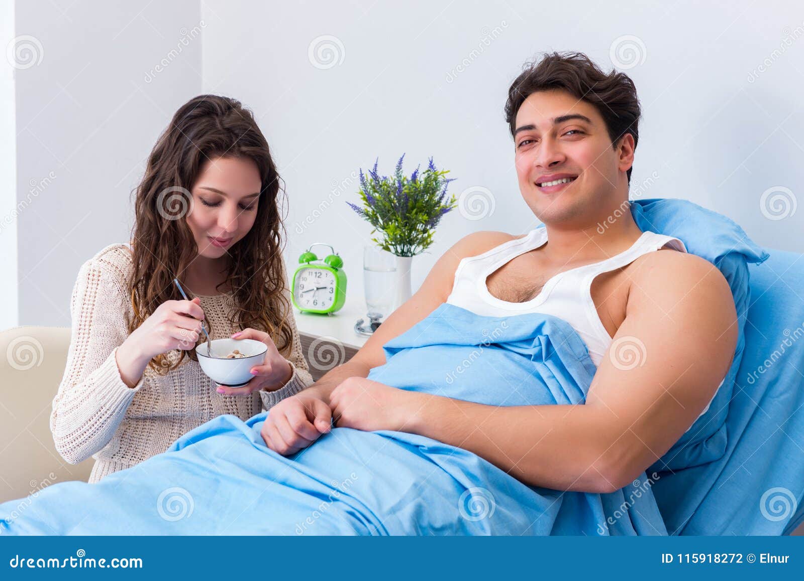 The Wife Visiting Ill Husband In The Hospital Room Stock Photo picture