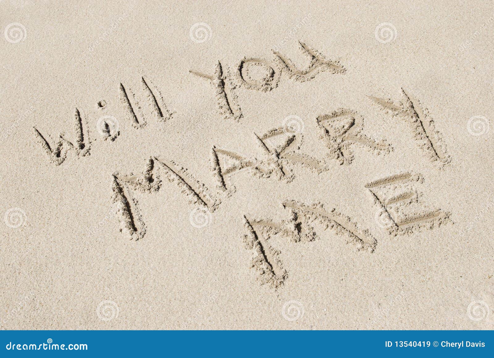 will you marry me written in sand
