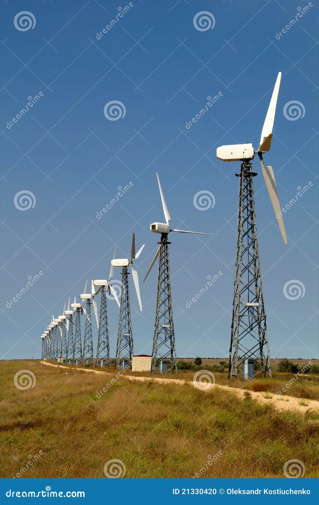 the wind generators against the blue sky