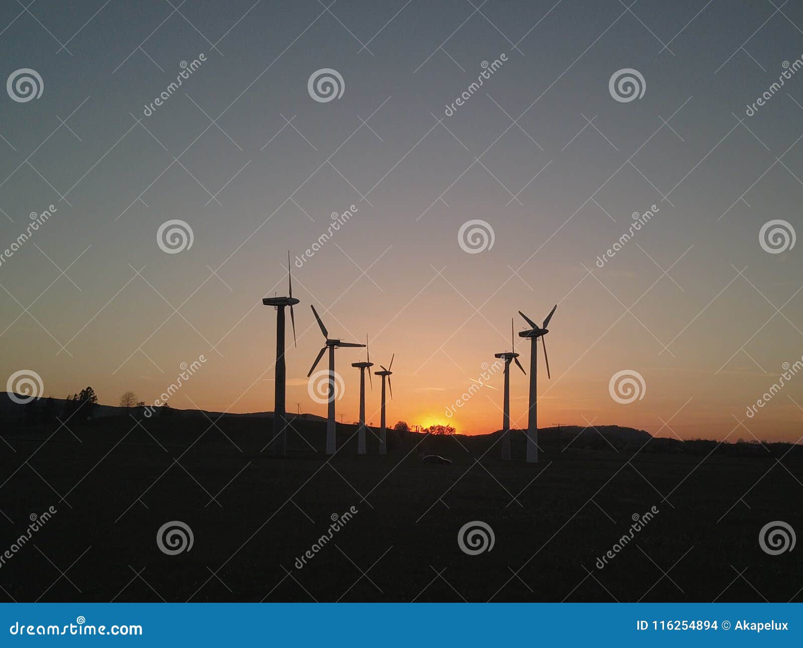 wind power station in the sunset. rotating blades of energy generators. ecologically clean electricity. modern technologies for t