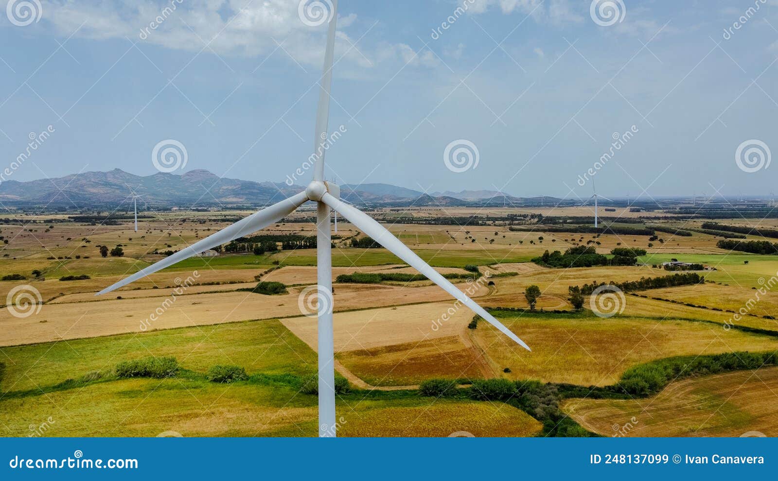wind turbine with a cloudy and gray sky, villacidro