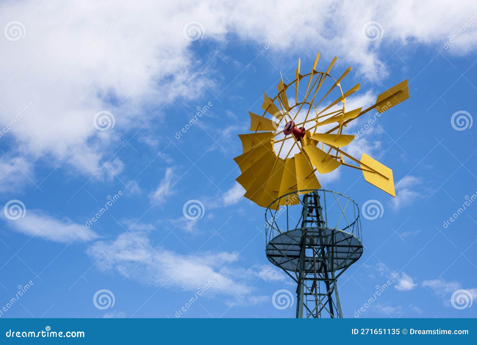 wind turbine, with the yellow blades producing energy