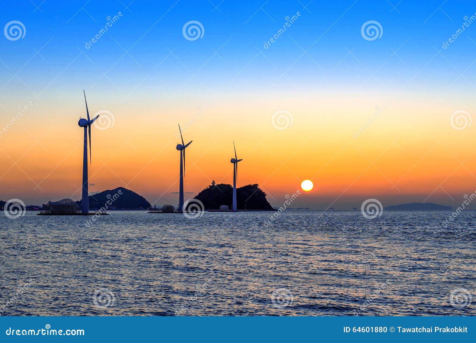 Wind Turbines Generating Electricity at Sunset in Korea. Stock Photo