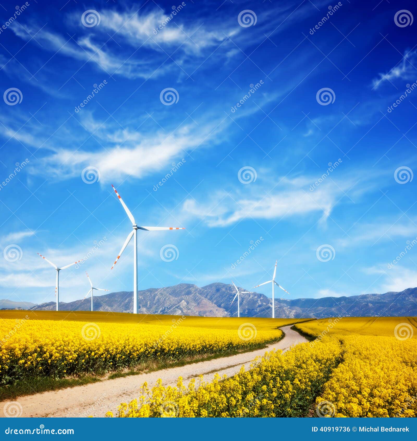 wind turbines on spring field. alternative, clean energy