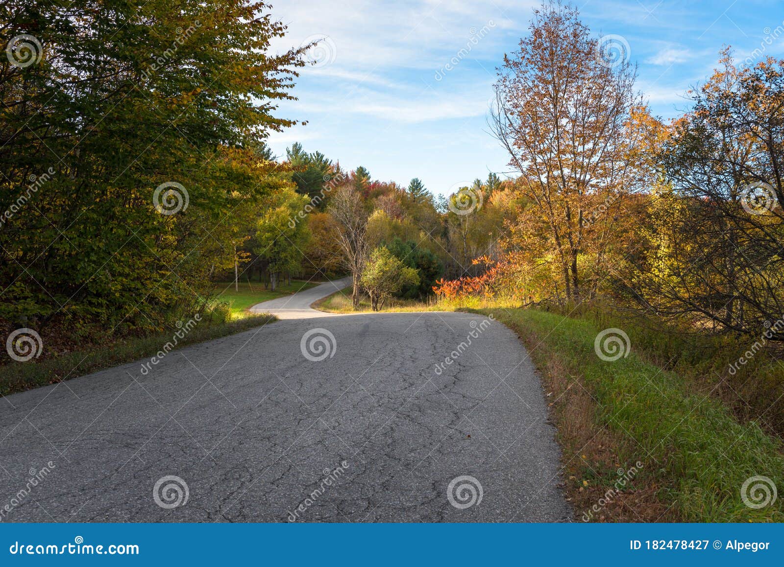 empty curving road countryside at sunset