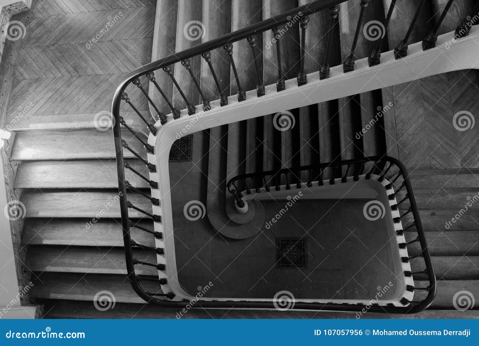 winding interior staircase with bannister