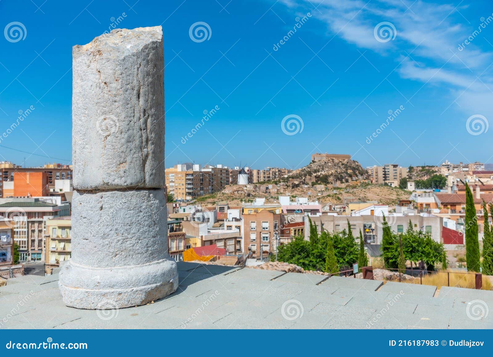 windmill and fortress on monte sacro viewed from archeological park on cerro del molinete in cartagena, spain