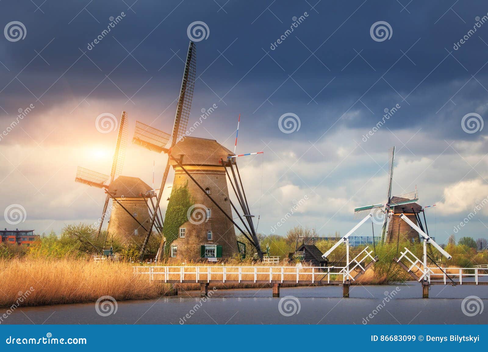 windmills against cloudy sky at sunset in kinderdijk, netherland