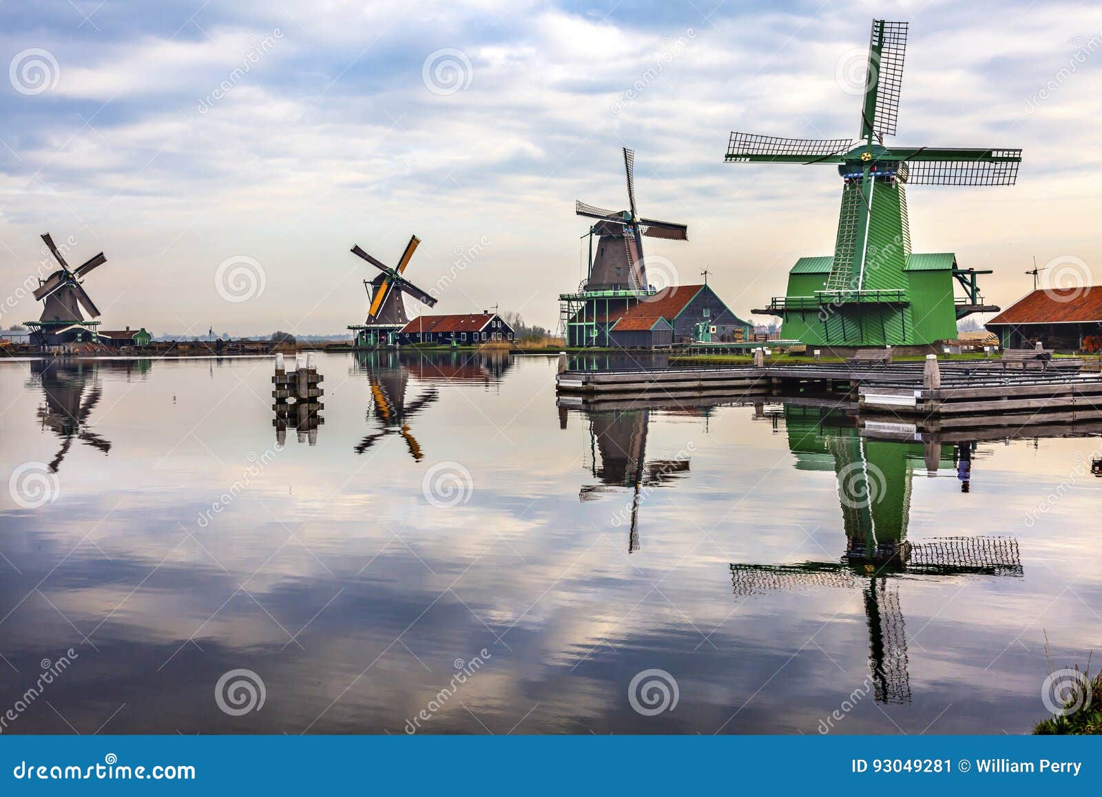 windmills reflection river zaan zaanse schans village holland netherlands