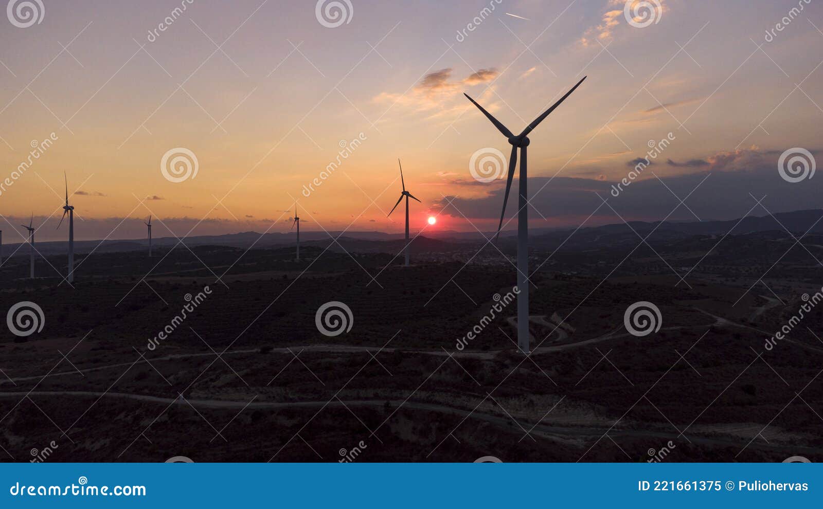 windmills at sunset, aerial photo wind energy