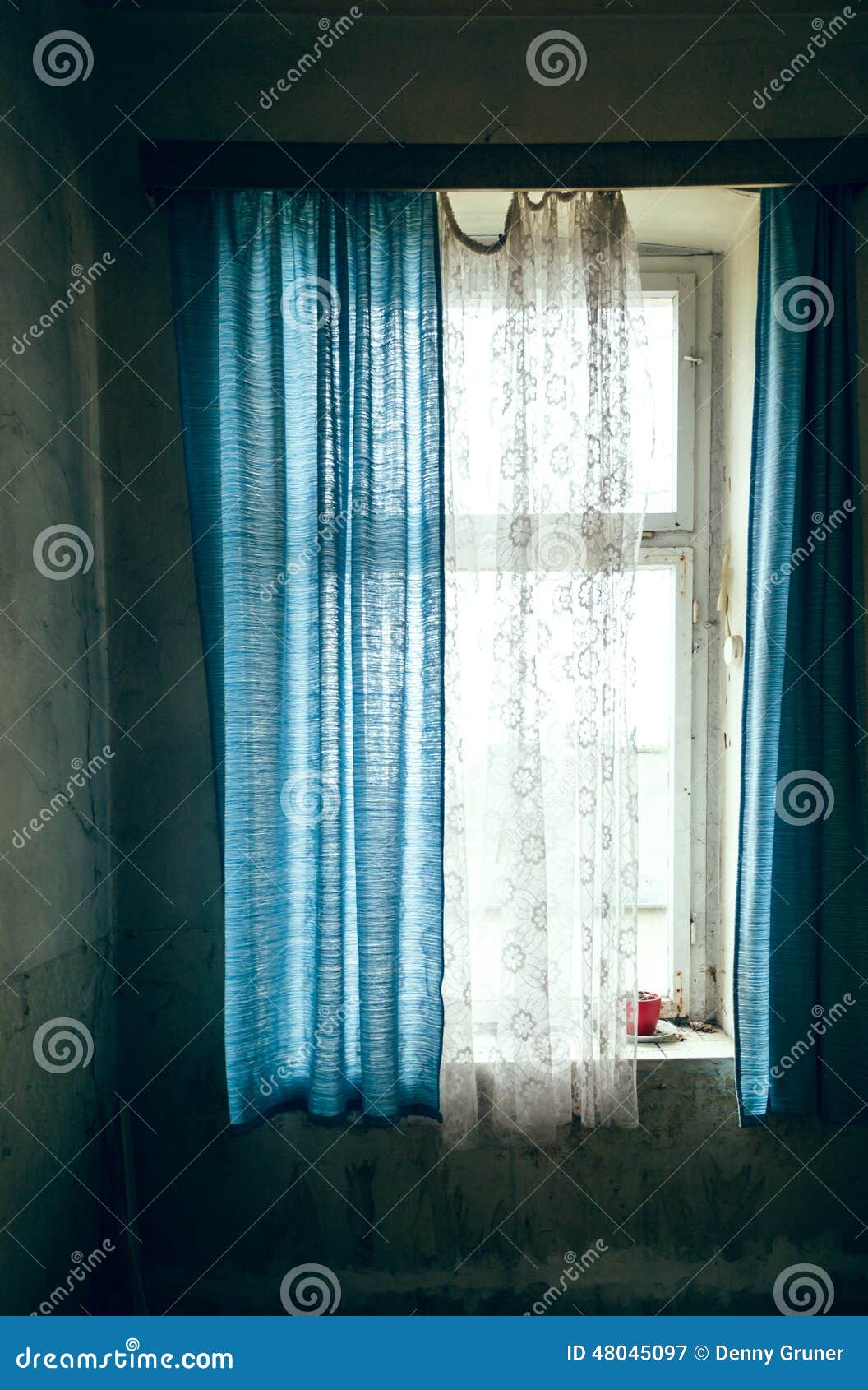 Window with blue curtain stock image. Image of curtains 48045097