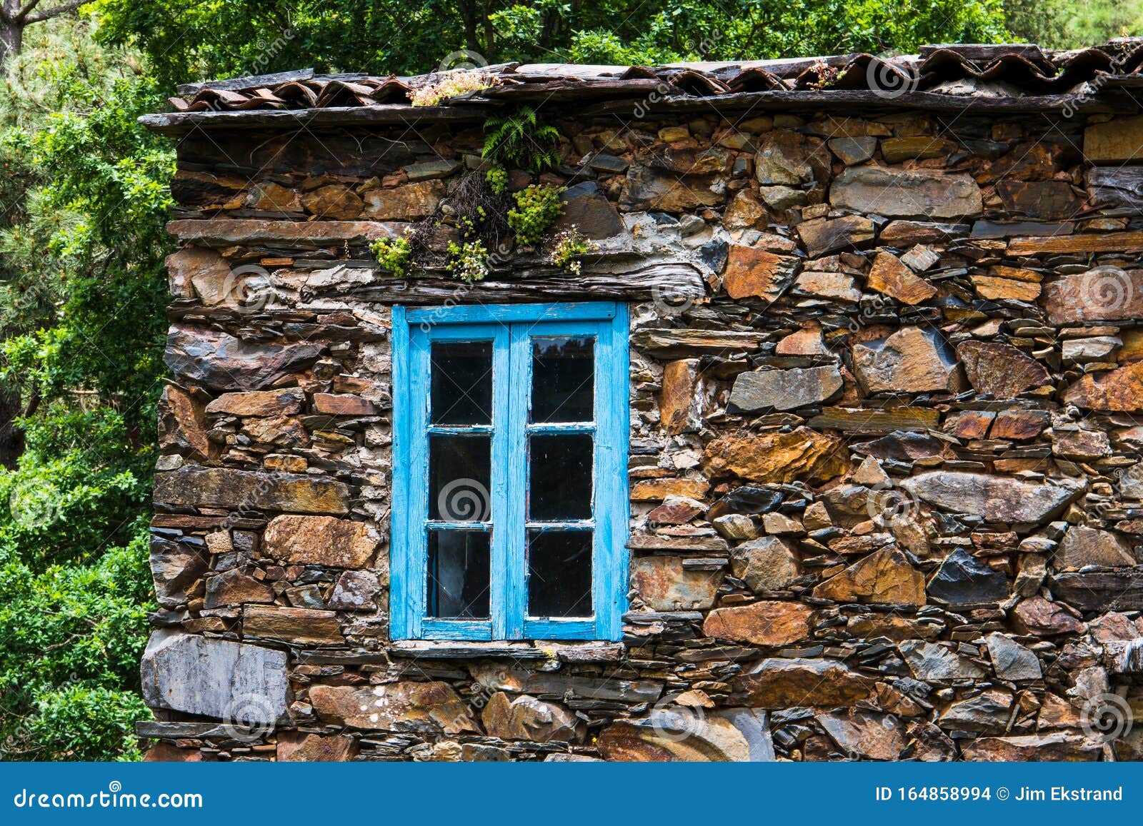 window-blue-rustic-wood-trim-set-stone-wall-old-house-close-up-village-cerdeira-portugal-164858994.jpg