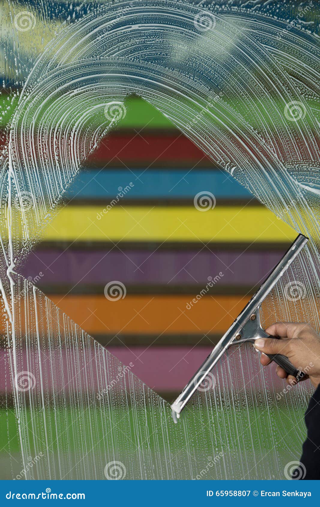 Window Cleaner Using a Squeegee To Wash a Window Stock Image Image of