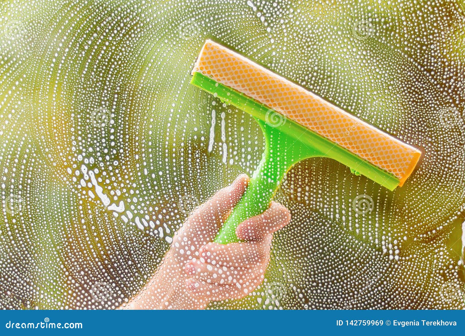 Window Cleaner Using a Squeegee To Wash a Window Stock Image Image of