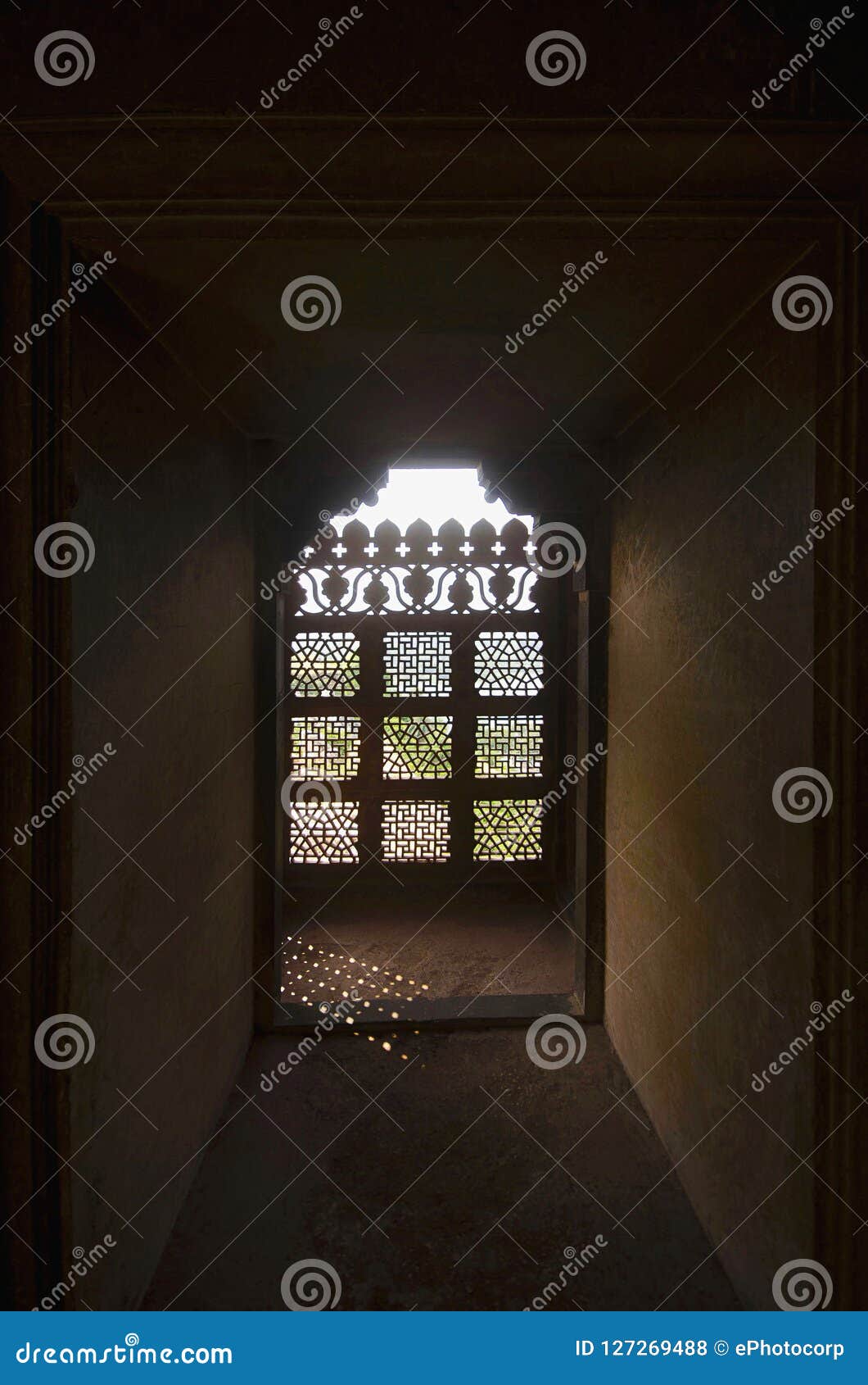 a window decorated with carvings. bir singh palace or bir singh dev palace. dati. madhya pradesh