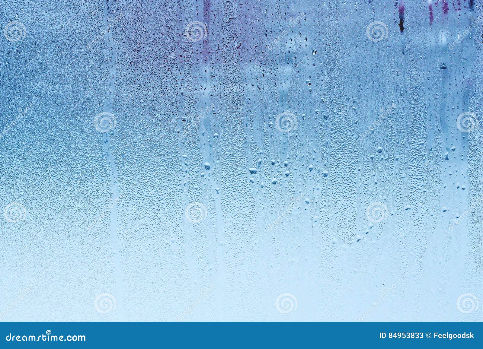 window glass with condensation, high humidity in the room, large water droplets, cold tone