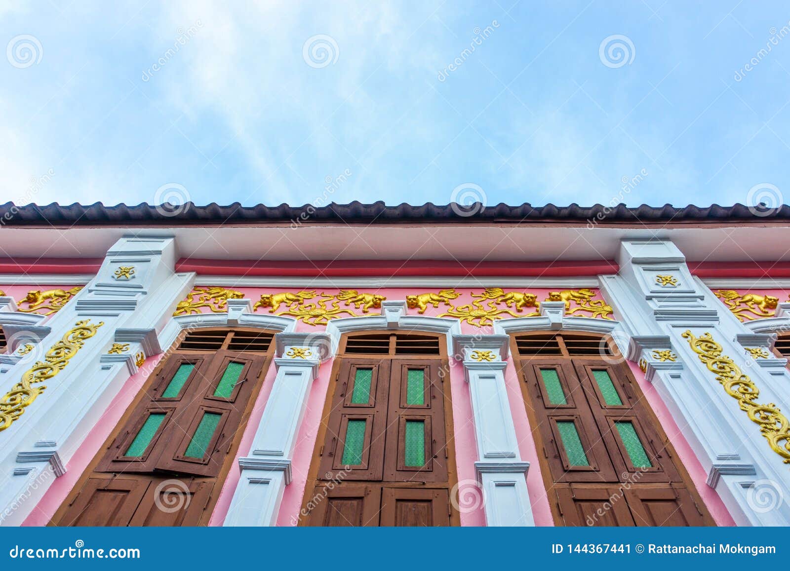 window with pink background in chino-portuguese style, phuket thailand