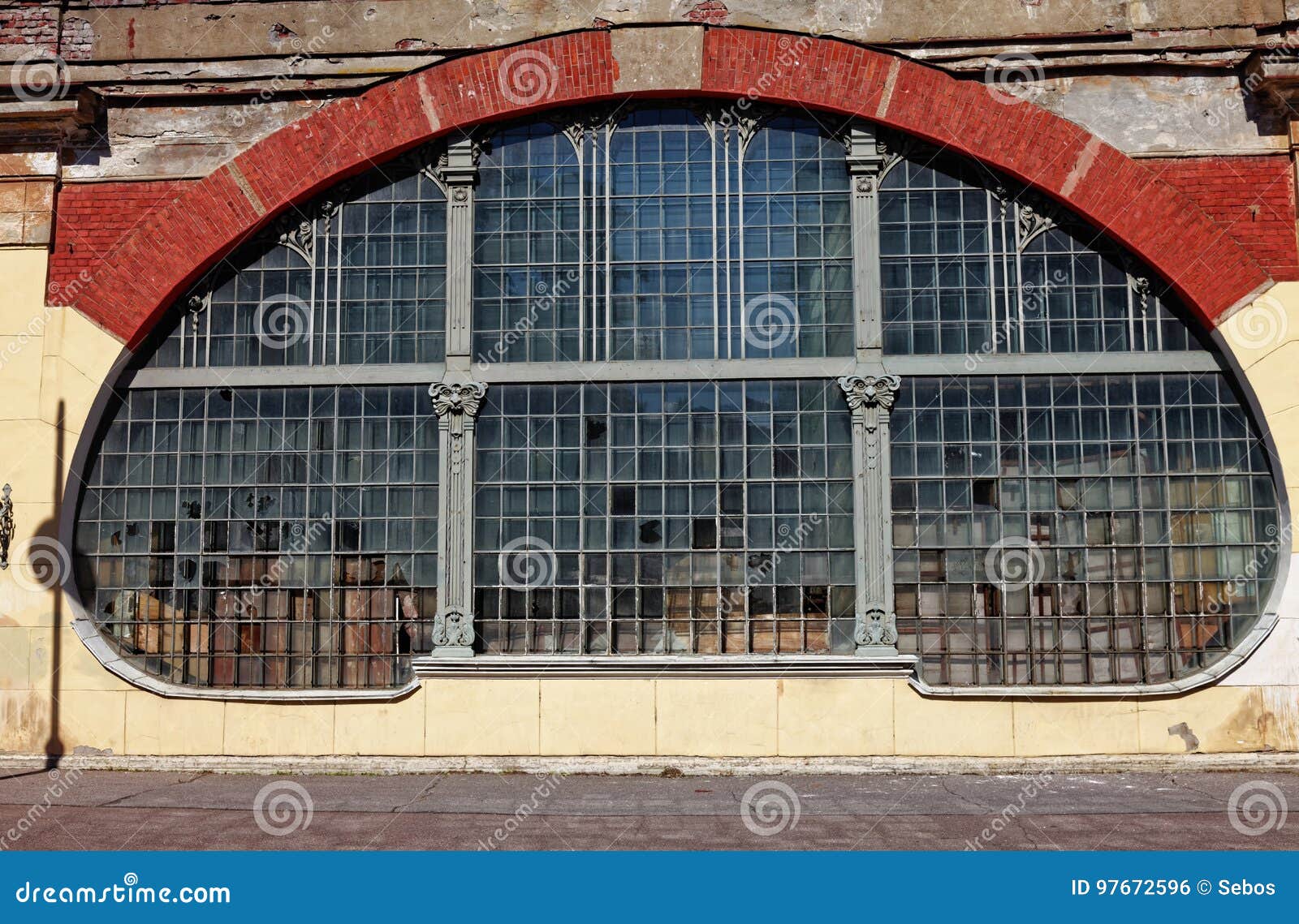 Window in the style of Art Nouveau. The facade of the old factory in Kronstadt, Russia.