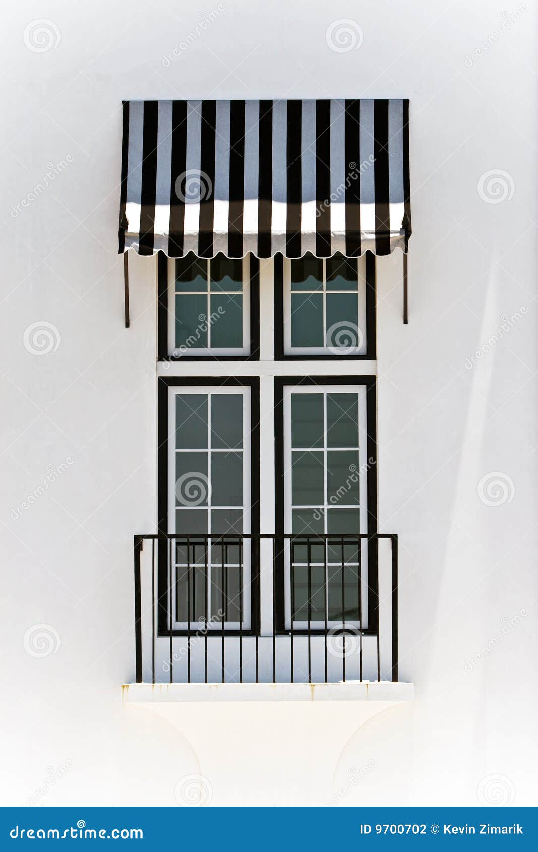 windows with black and white awning