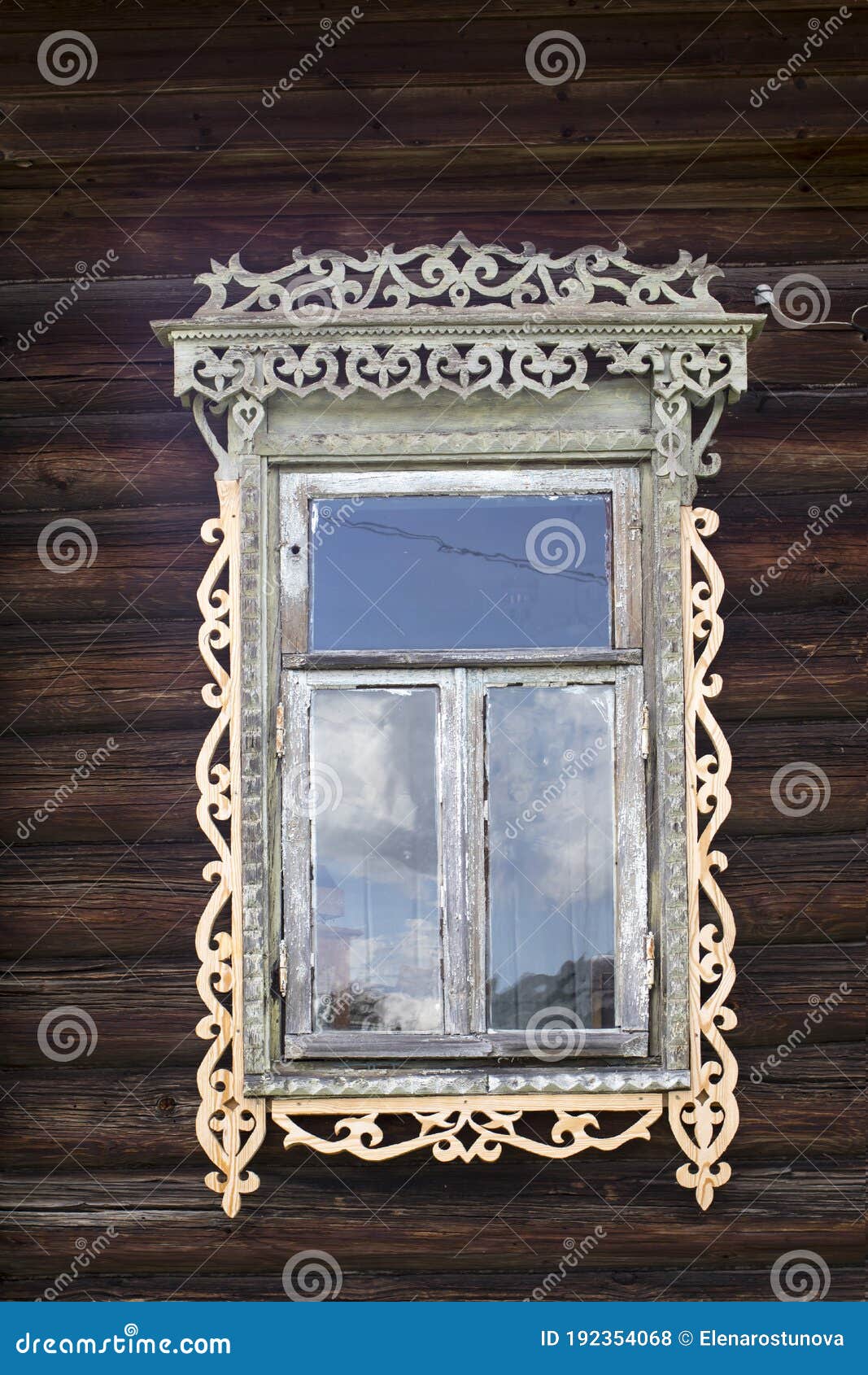 windows with carved frames and shutters in village houses