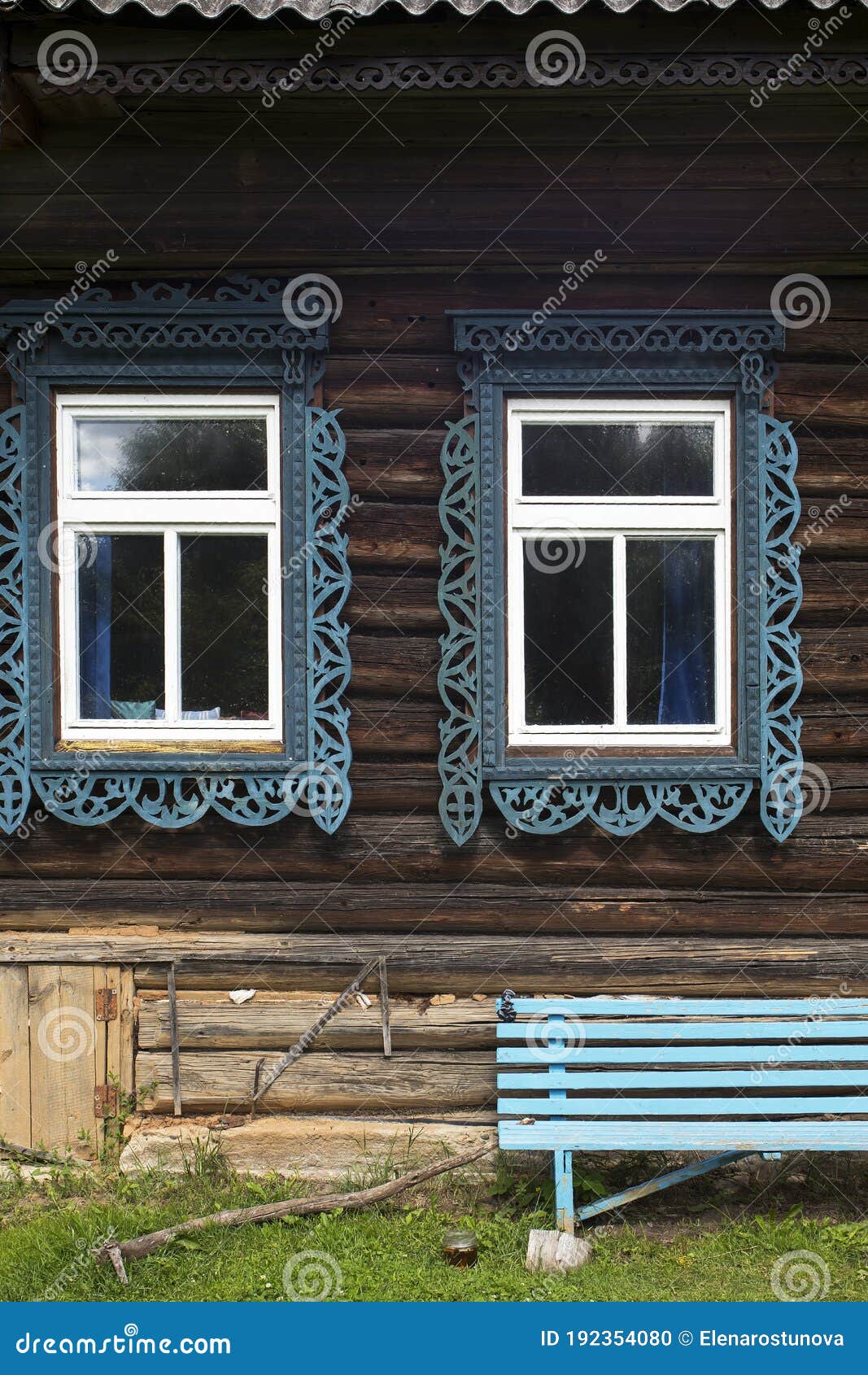 windows with carved frames and shutters in village houses