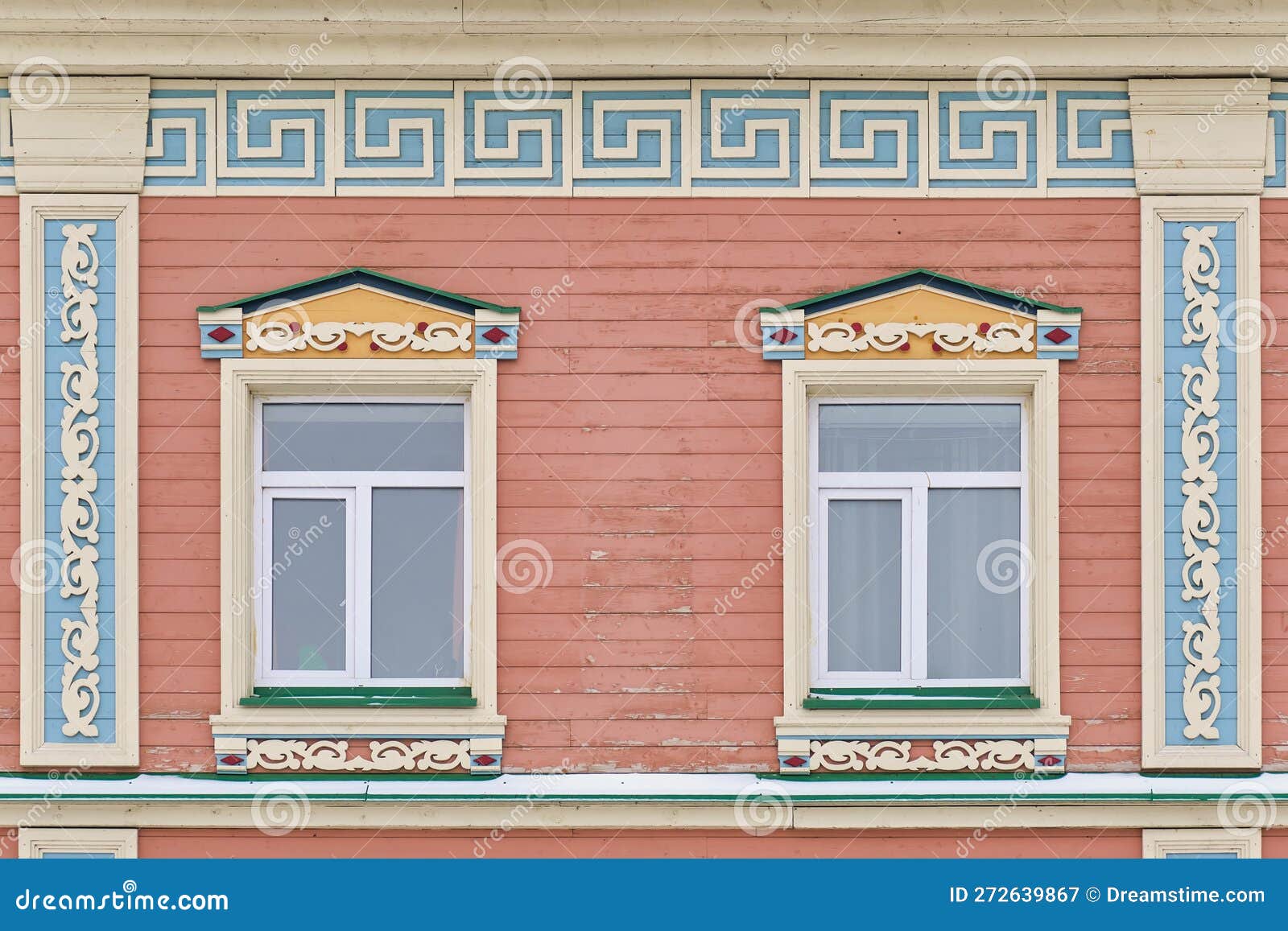 Windows with Carved Wooden Architraves on Facade of House of 19th