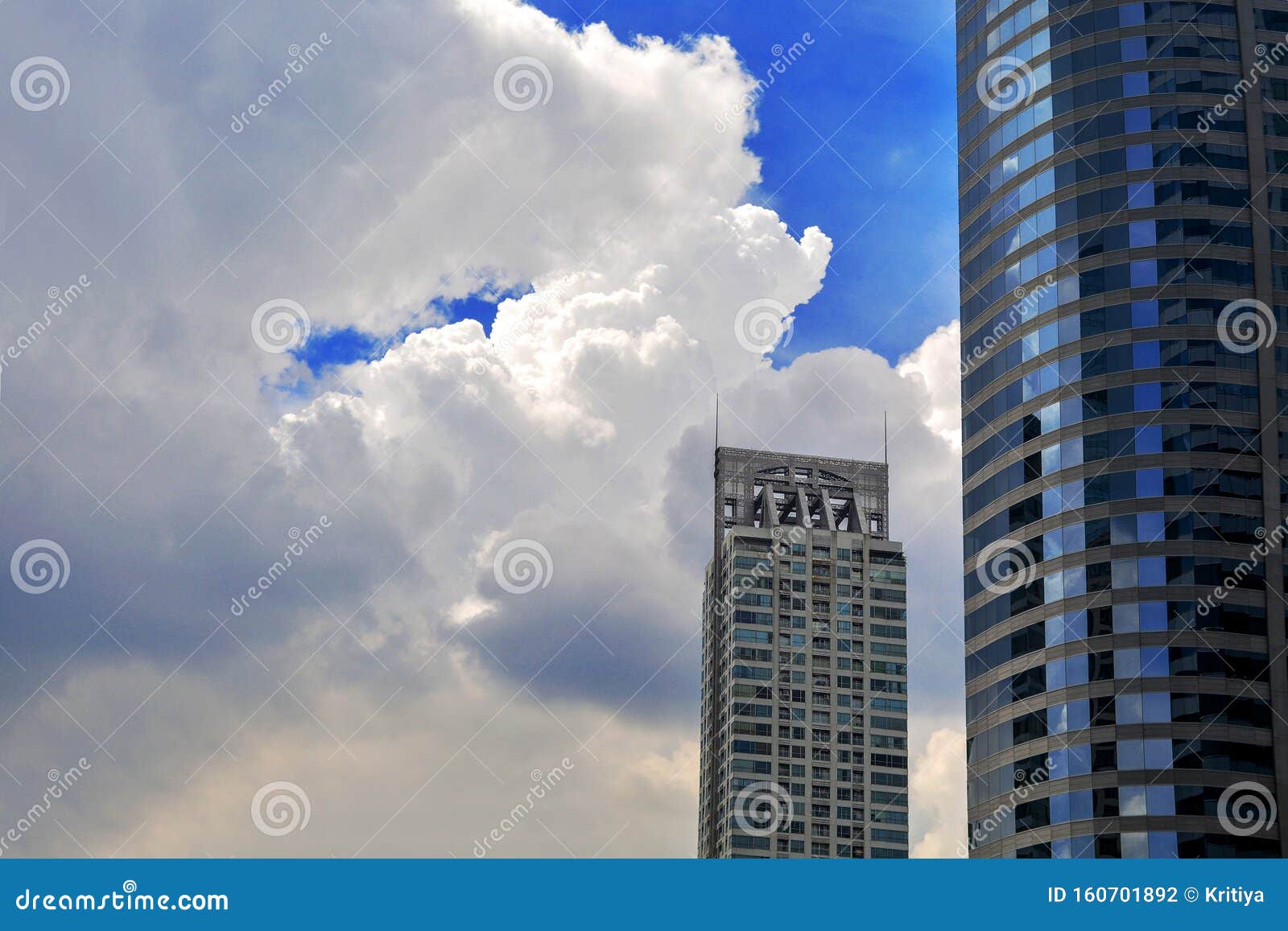 windows of skyscraper business office with blue sky, corporate building in bangkok city
