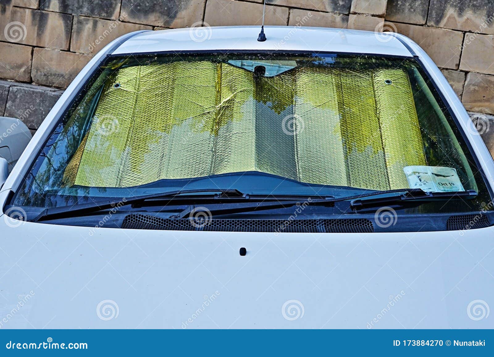 Windshield of Car with Protective Reflective Sunscreen Surface Inside