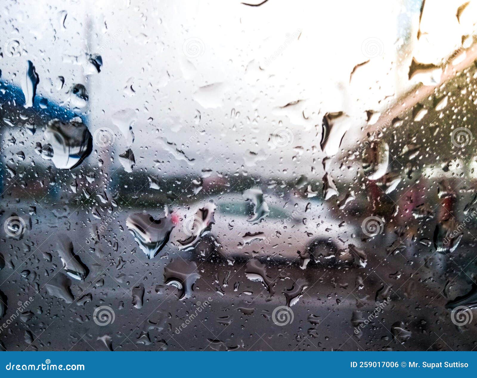 Windshield Rain Drops in a Gas Station, the Background is Blurred Stock