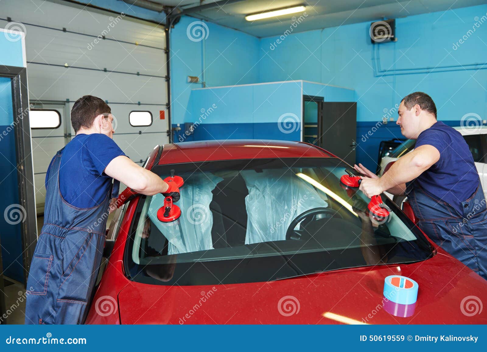 Adding Windshield Washer Fluid At Gasolin Station By Driver. Closeup