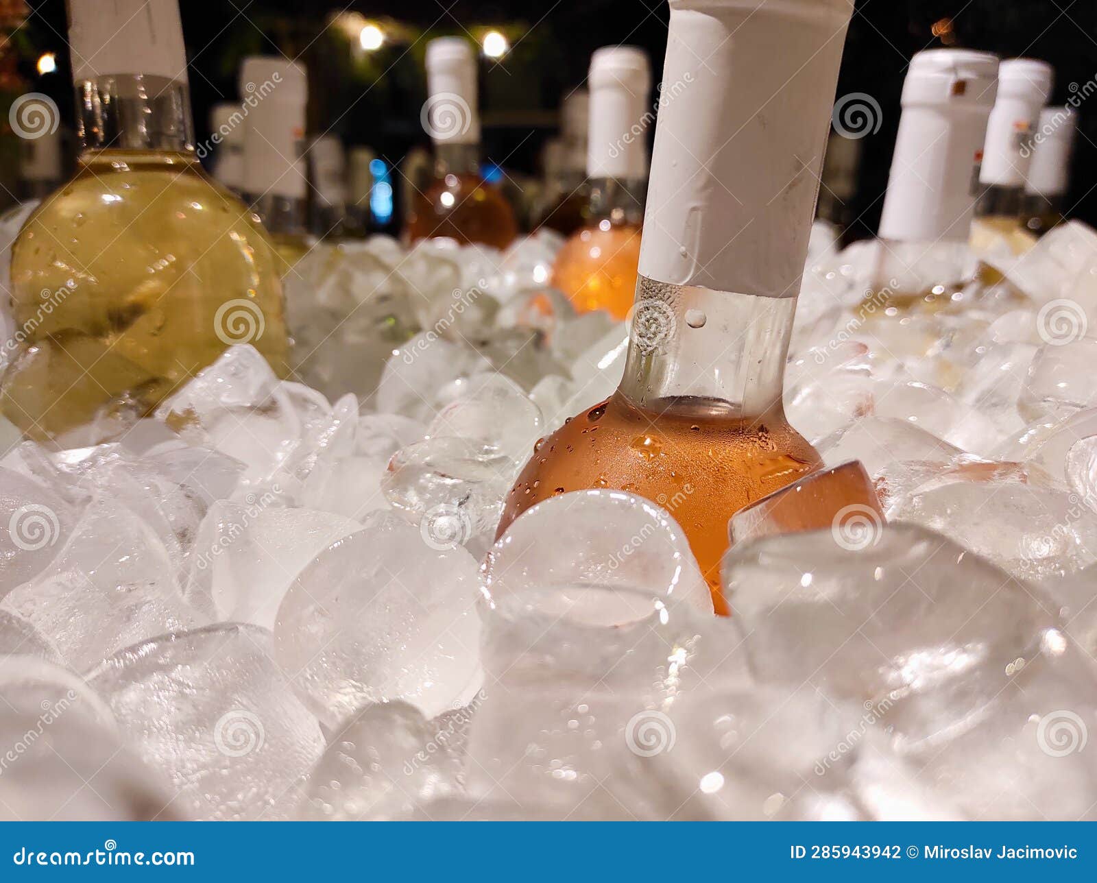 wine and alcohol cooling in ice on terraza - summer fun