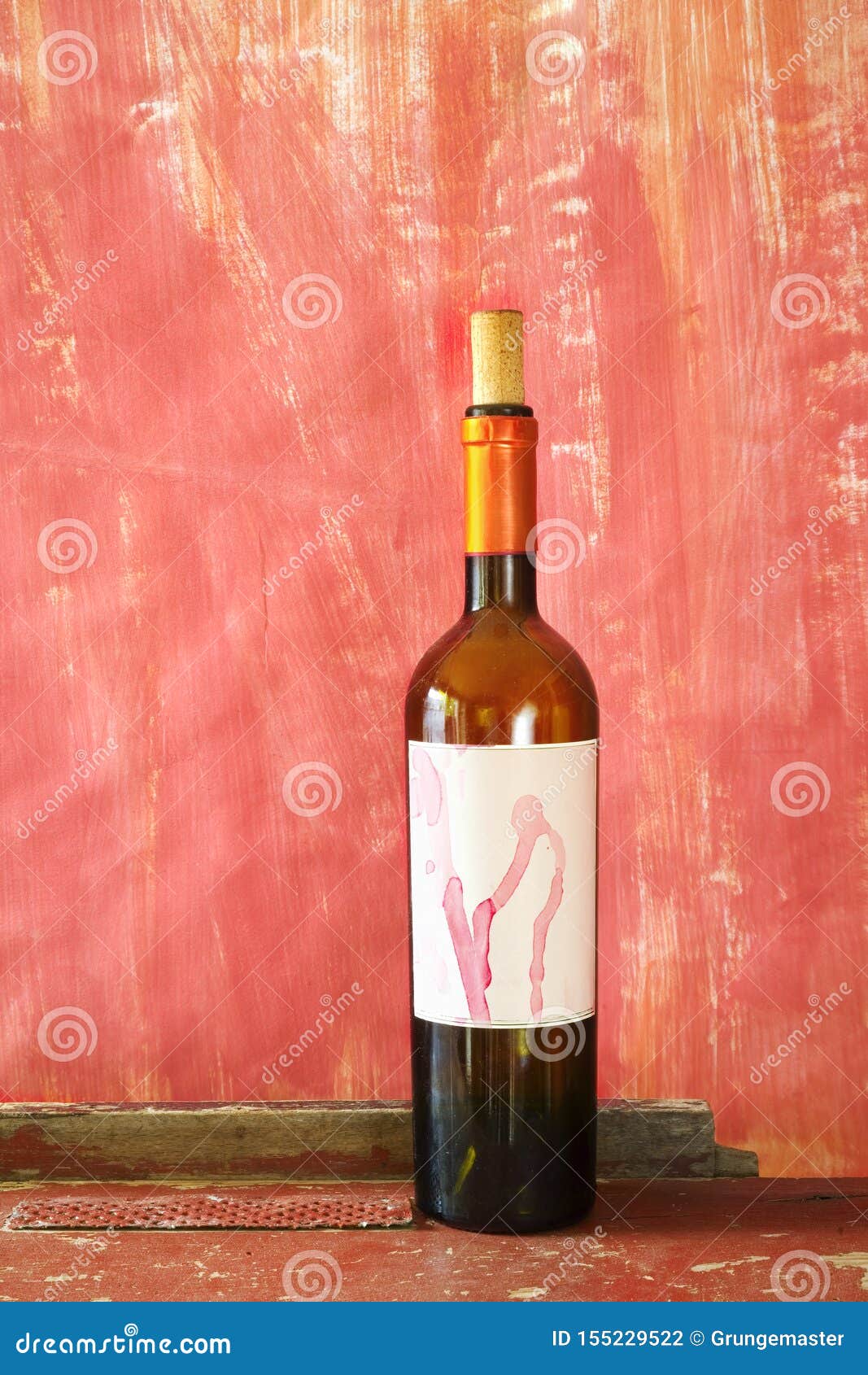 wine bottle with blank label,  free copy space, grungy red background. wine, winetasting, wine season mock up