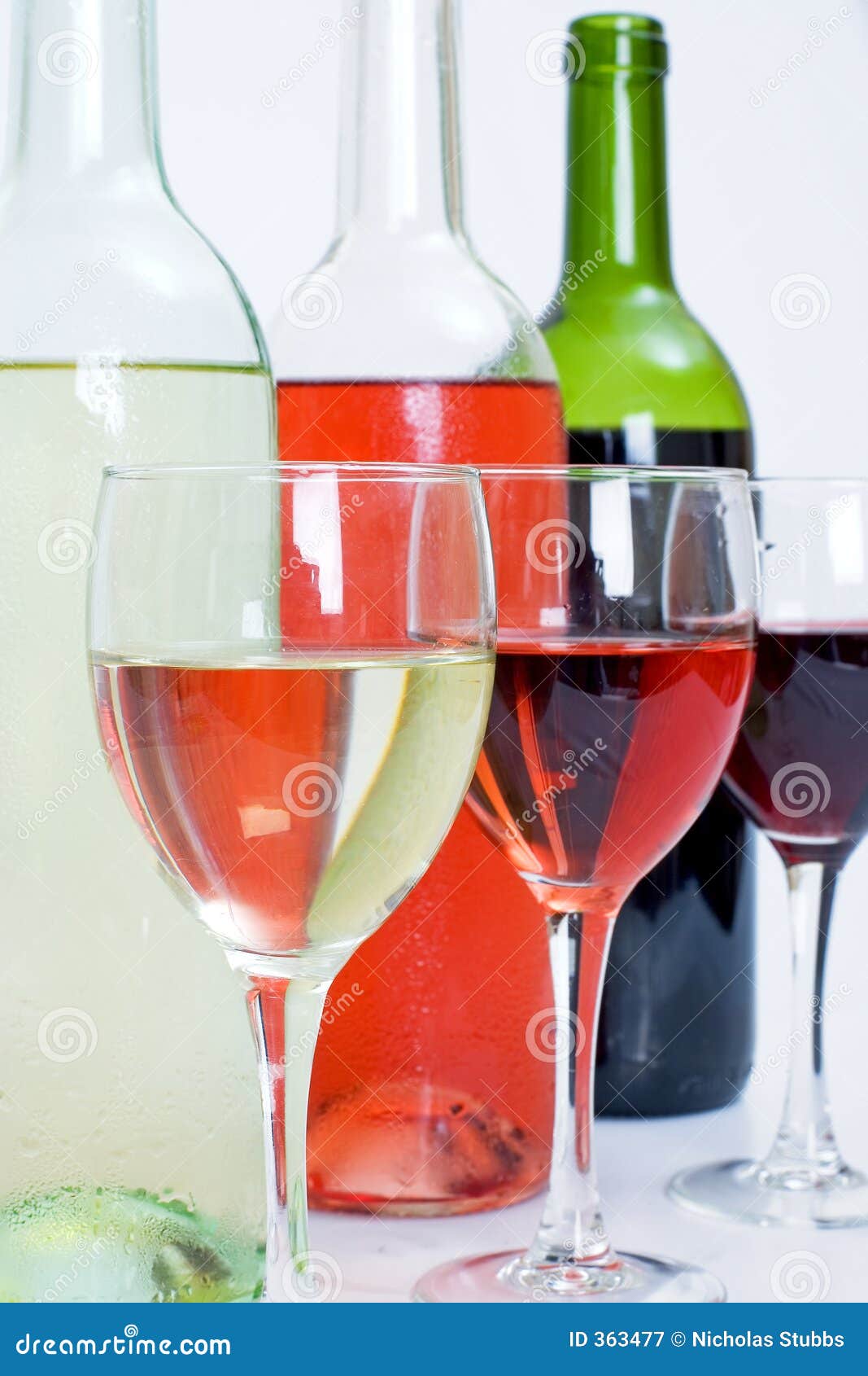 Wine bottles and Glasses stock image. Image of room, full 363477
