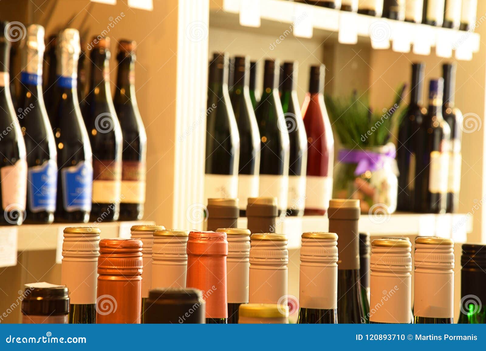 Wine bottles in wine store stock photo. Image of case 120893710