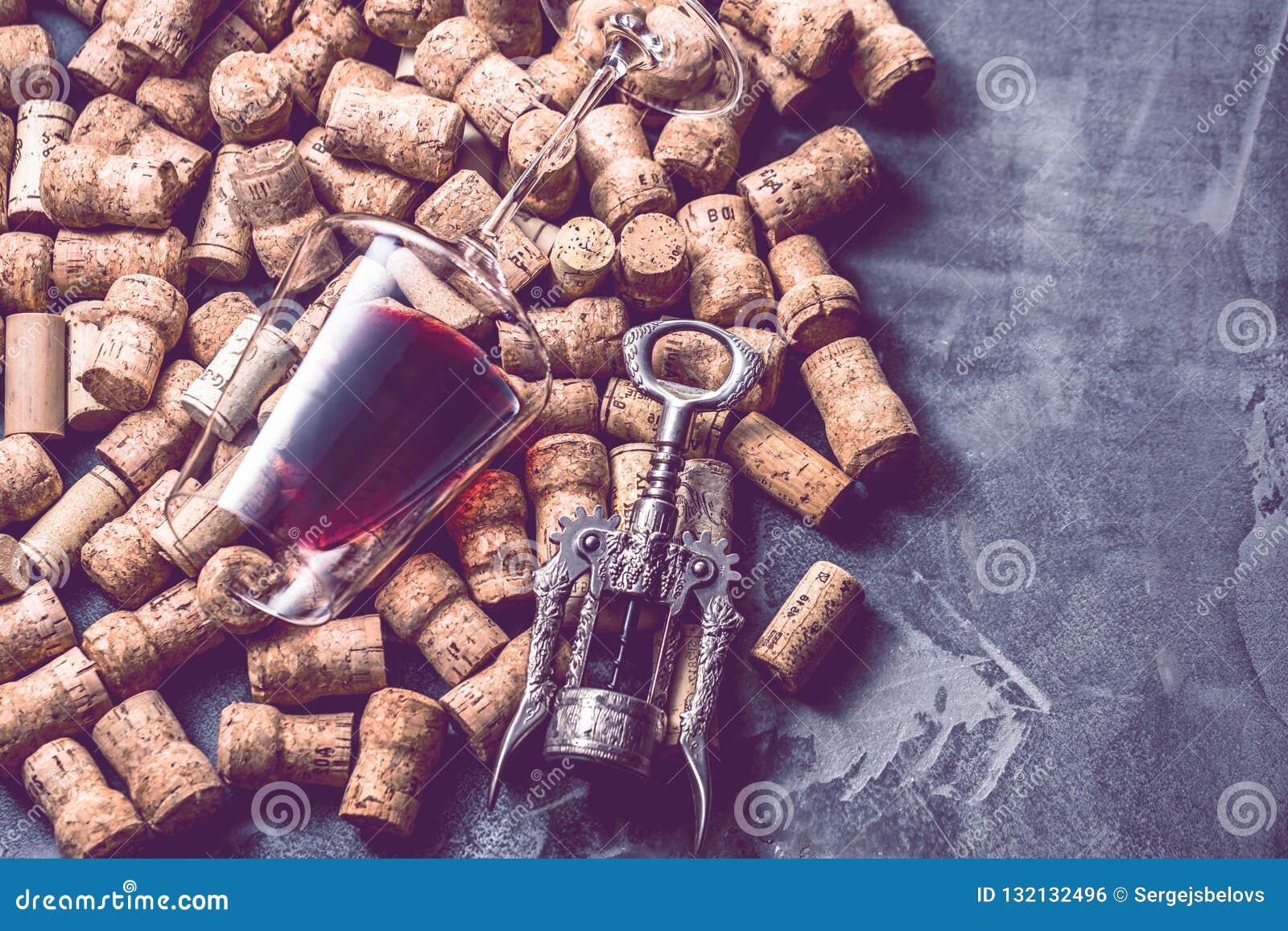 Wine Corks Grape Shape and Vine on Stone Table. Top View with Copy