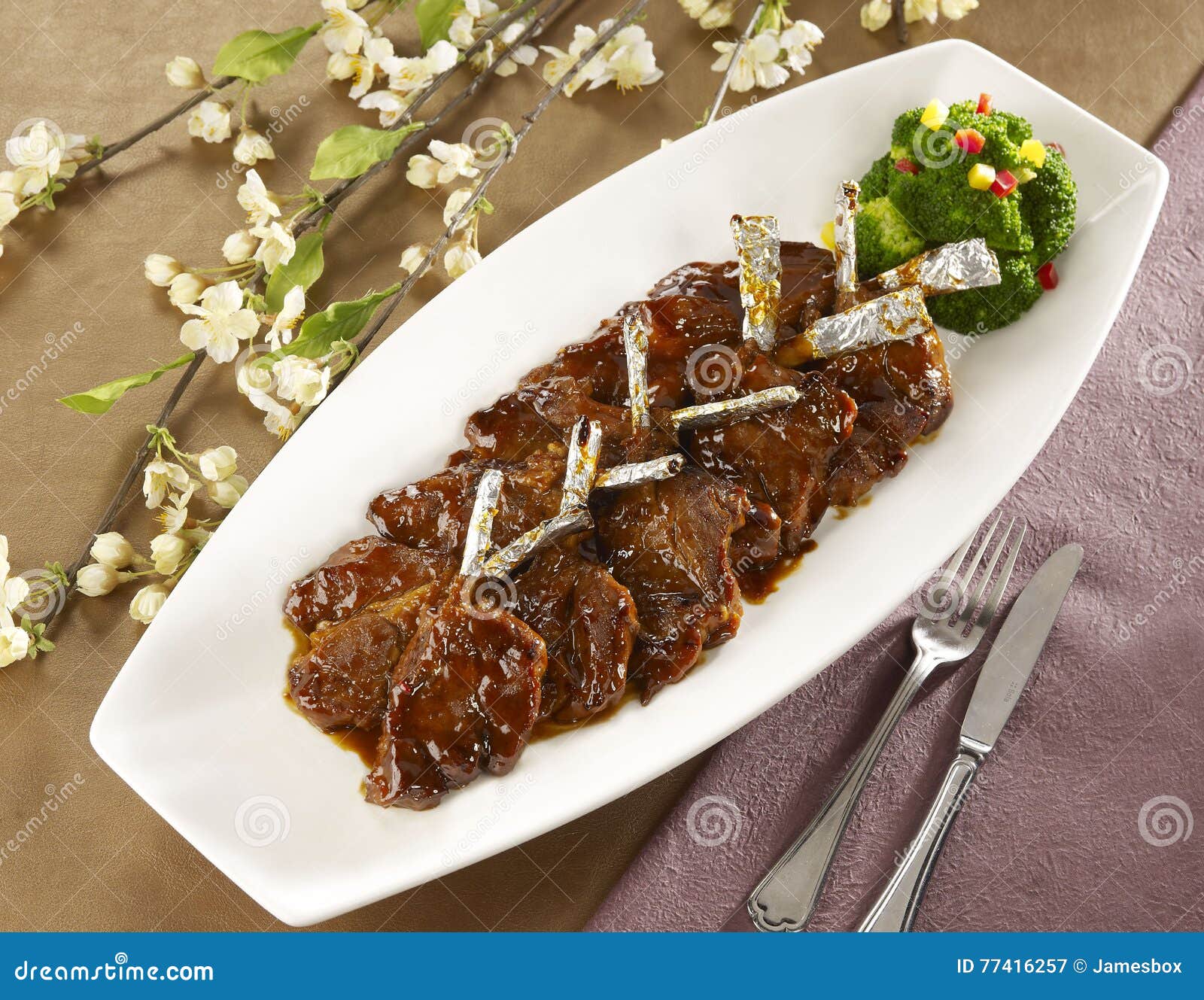 Wine Fried Lamb Cutlets on White Plate in Restaurant Stock Image