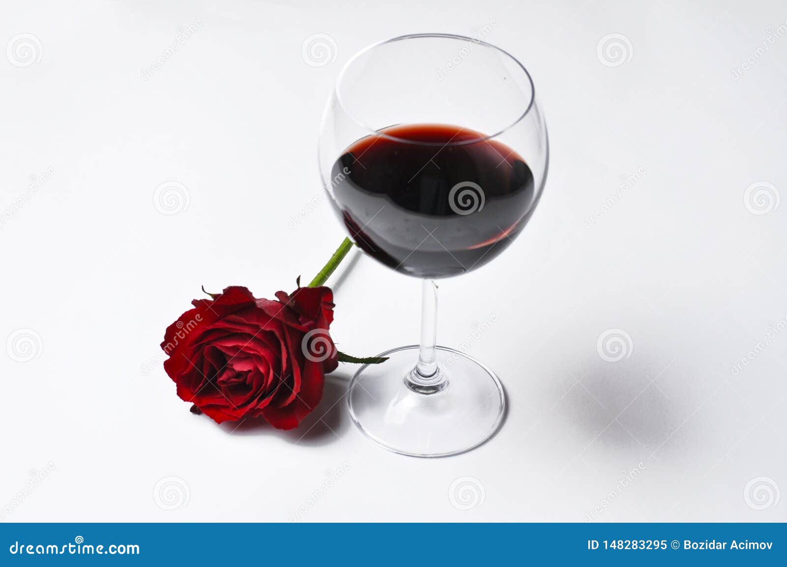 Wine Glass and Beautiful Red Rose Isolated on White Background.Copy