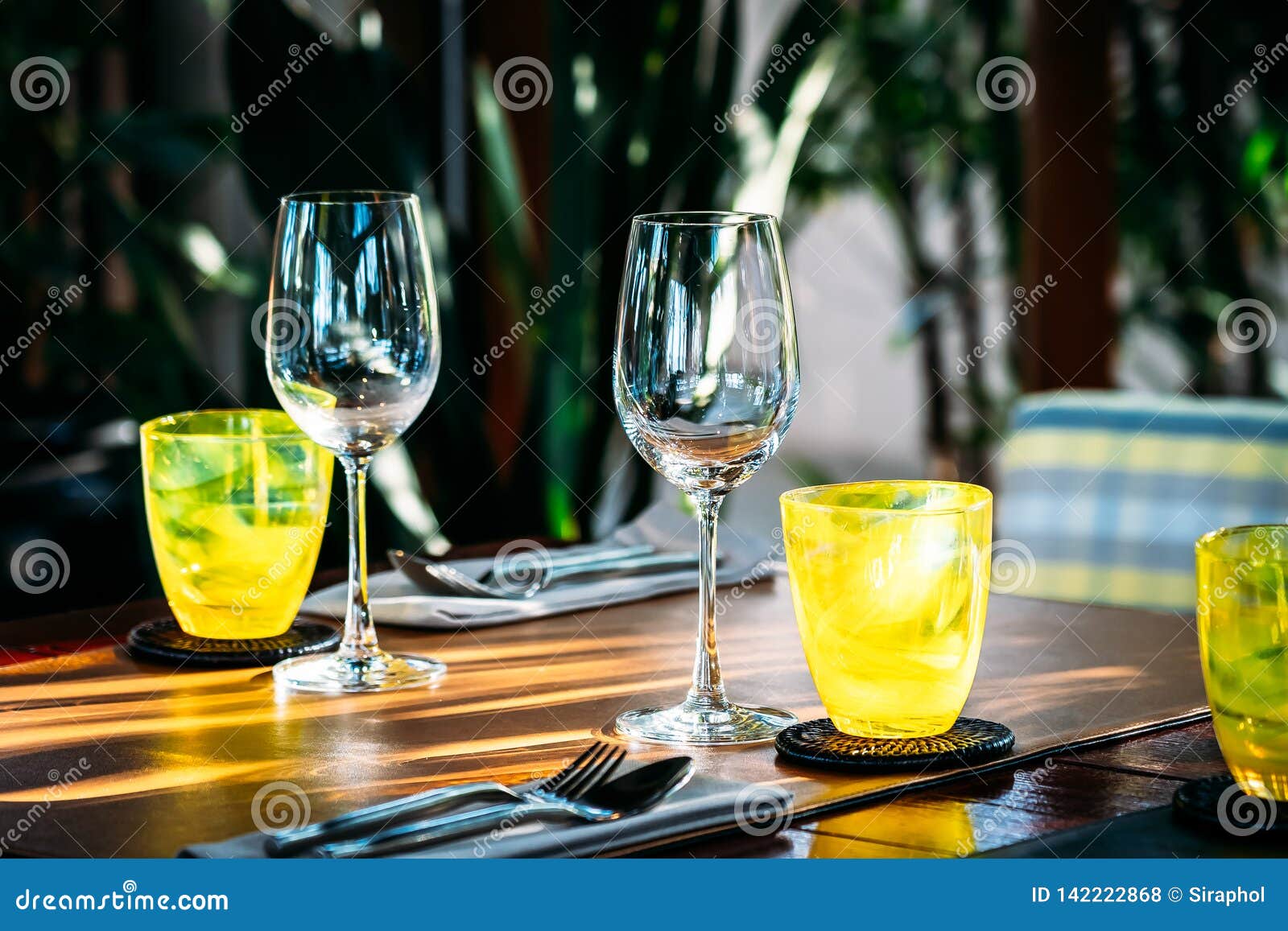 Wine Glass with Dining Set Prepare for Breakfast Lunch or Dinner on Table in Restaurant Stock