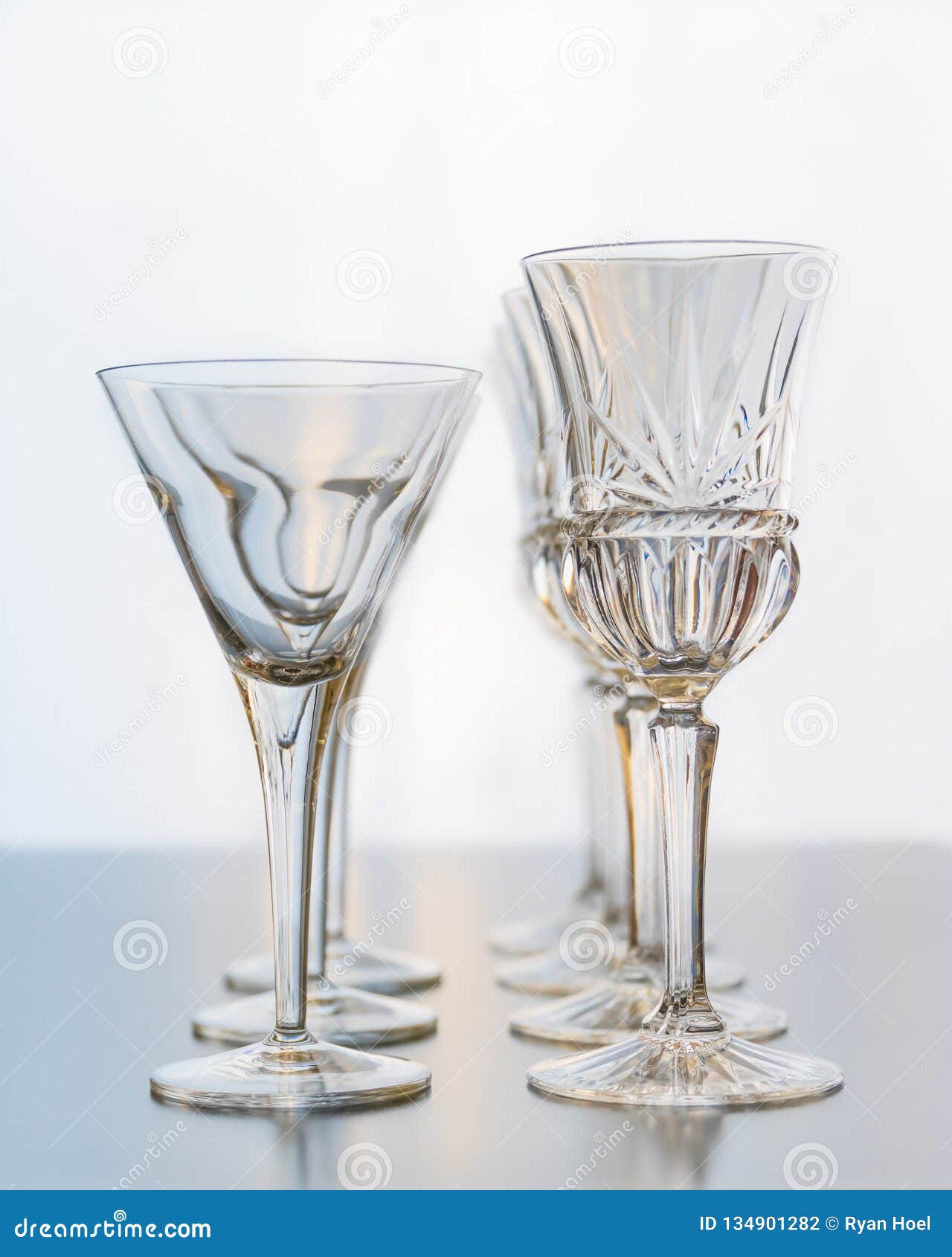 Decoration Setup Of Wine And Martini Glasses Set On A Reflective