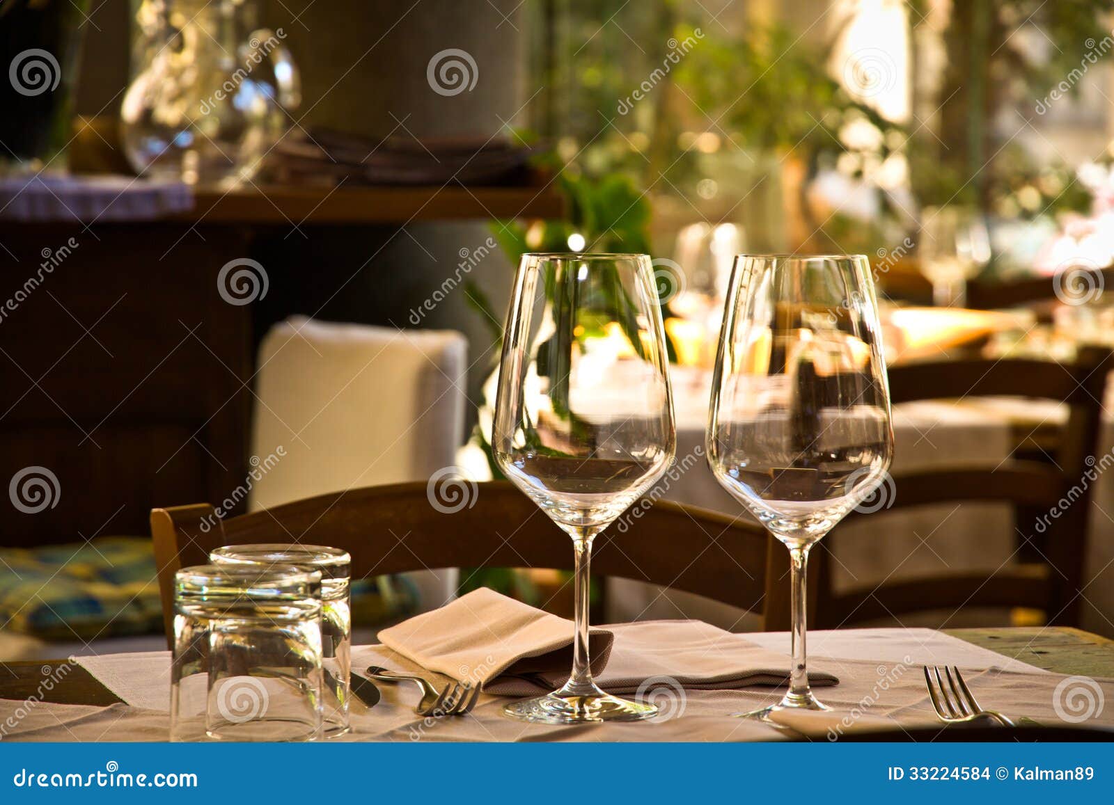 wine glasses and table setting in restaurant