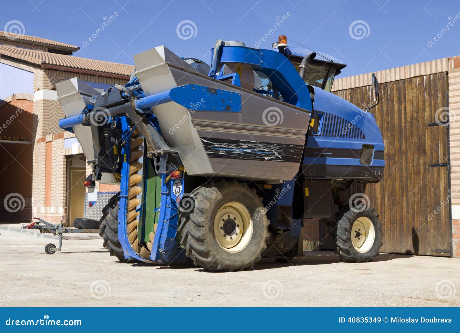Wine grape harvester stock image. Image of wine, wheels 40835349