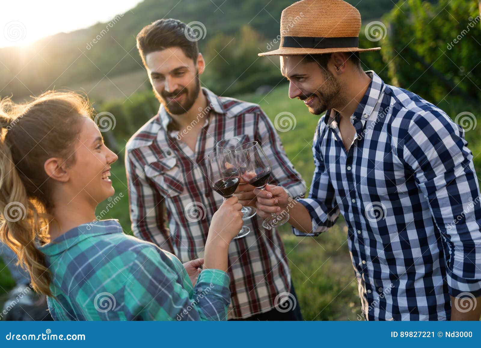 wine grower and people in vineyard